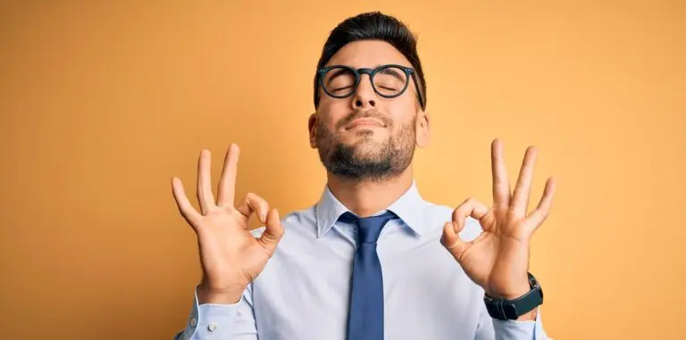 Young,Handsome,Businessman,Wearing,Tie,And,Glasses,Standing,Over,Yellow