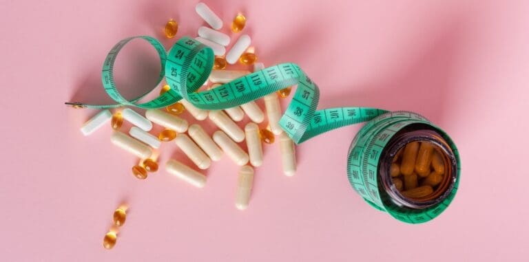 Weight,Loss,Pills,Scattered,From,Bottle,,Diet,Supplements,Capsules,,Obesity/